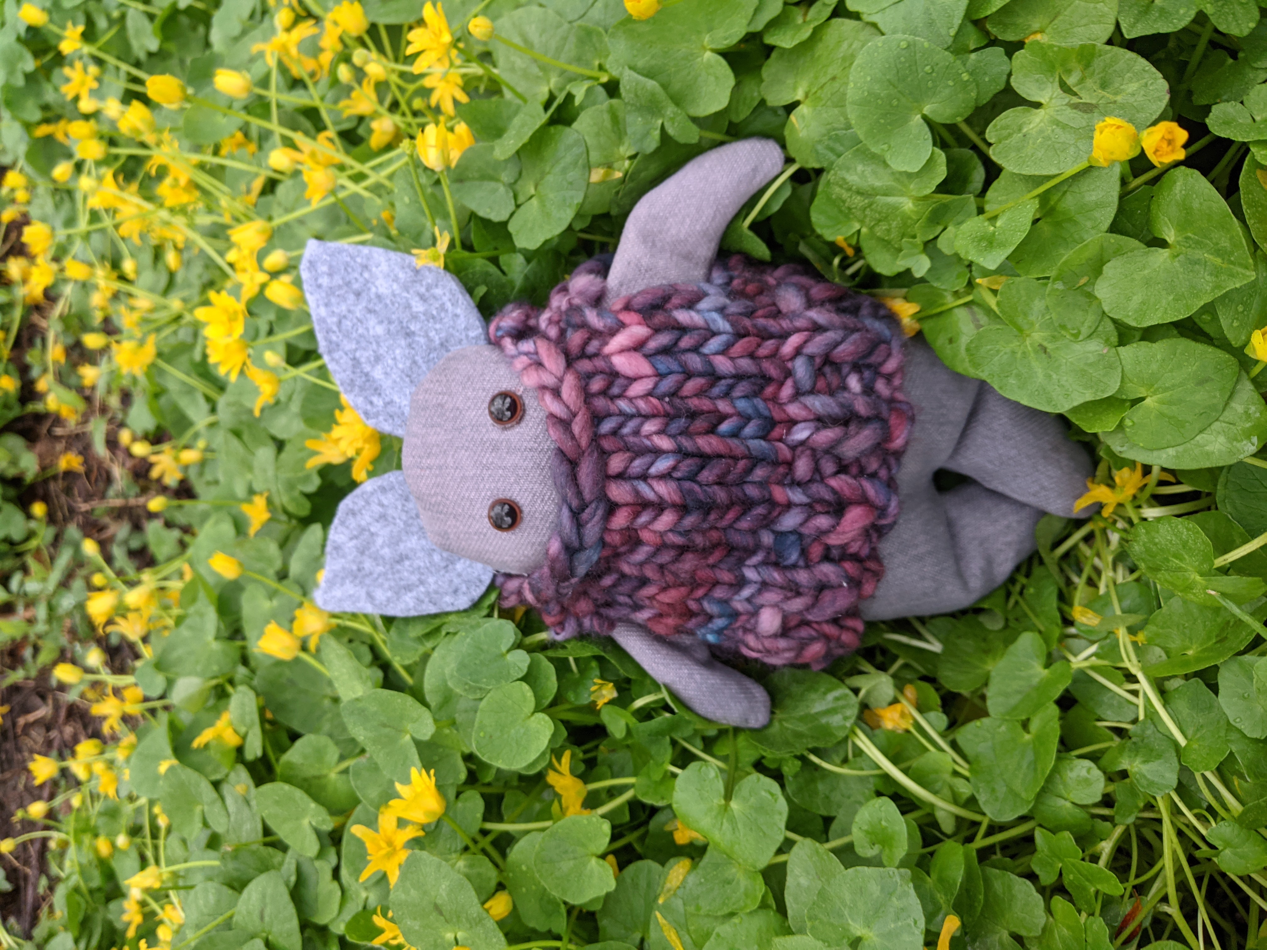 Small stuffed animal against a floral background