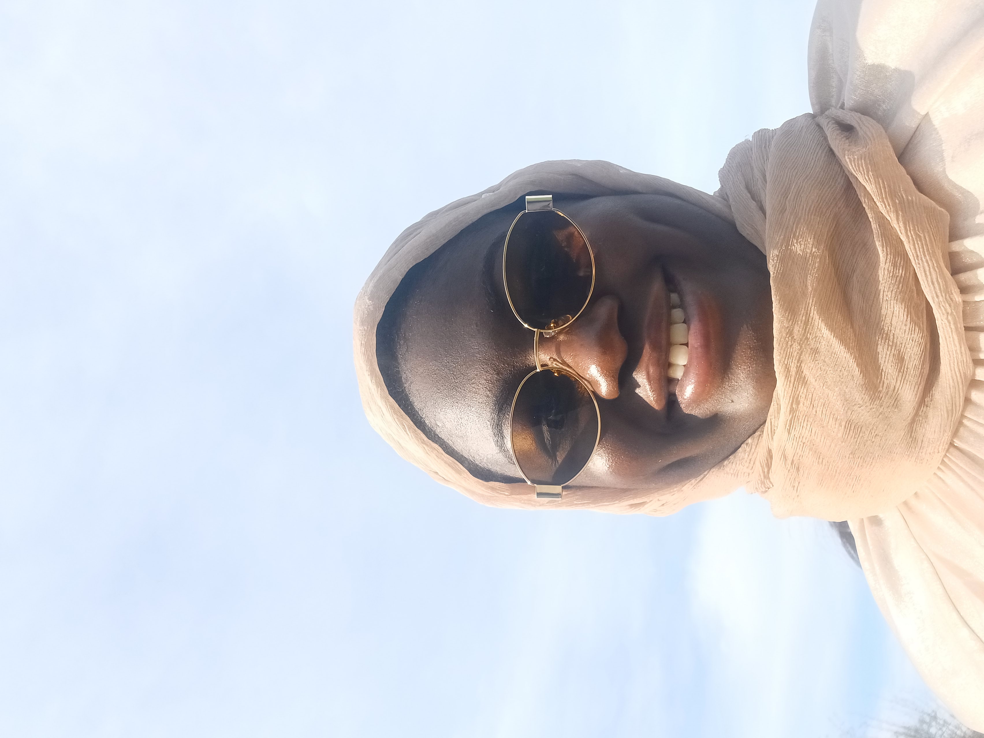 Hanaan Tawfiq smiles at camera.